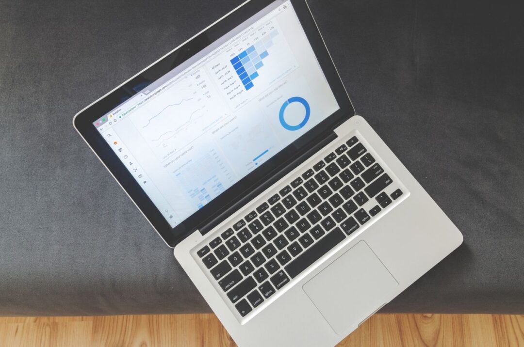 Laptop displaying marketing analytics charts